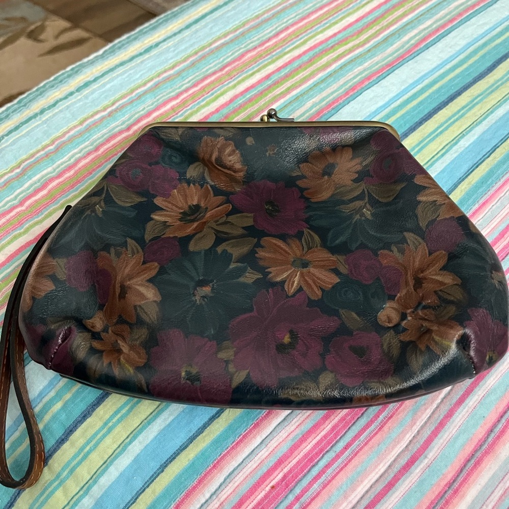 Blue flower leather wristlet. Patricia Nash